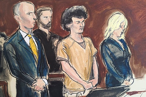 In this courtroom sketch, Sam Bankman-Fried, second from right, stands while making a statement during his sentencing in Manhattan federal court.