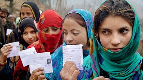 Image of voters standing in a long queue to cast their votes in the J&K Assembly Elections used for representative purpose.