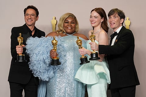 L-R: Robert Downey Jr., winner of the award for best performance by an actor in a supporting role for "Oppenheimer," from left, Da'Vine Joy Randolph, winner of the award for best performance by an actress in a supporting role for "The Holdovers," Emma Stone, winner of the award for best performance by an actress in a leading role for "Poor Things," and Cillian Murphy, winner of the award for best performance by an actor in a leading role for "Oppenheimer,"