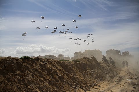 United States Air Force drops humanitarian aid to Palestinians in Gaza City, Gaza Strip, on Saturday, March 9.