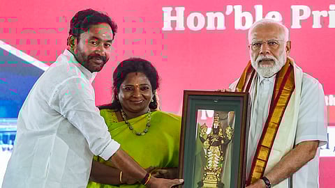 Prime Minister Narendra Modi being felicitated during the launch of development initiatives, in Adilabad, Telangana, Monday, March 4, 2024. Telangana Governor Tamilisai Soundararajan and Union Minister G Kishan Reddy are also seen.