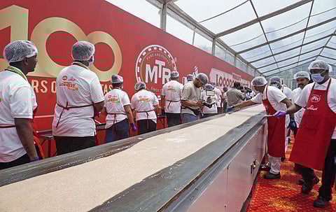 MTR celebrates 100 years with a Guinness world record title for the 123 feet longest dosa at MTR food Factory in Bengaluru