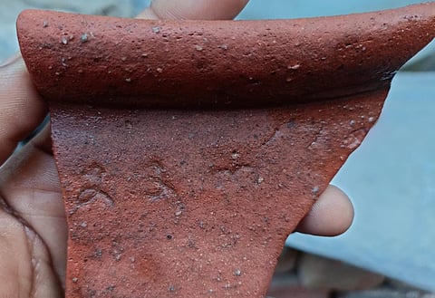 A fragment of a pot adorned with Tamil alphabets, said to be from the Chola-era, have been unearthed from Thenpennai riverbed.