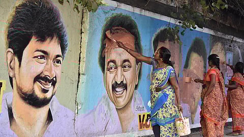 Workers erasing a painting of Stalin from a wall in Egmore after the model code of conduct came into effect on Saturday.
