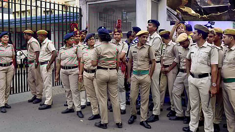 Security personnel stand guard outside Bhavani Bhawan as CBI officials take Trinamool Congress leader Sheikh Shahjahan, accused in the Sandeshkhali case.