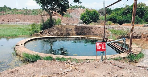 An open well filled to the brim at the Rail Wheel Factory in Yelahanka