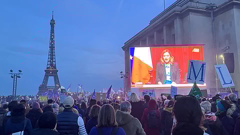 Pro-abortion supporters watch a live transmission of the congress session where French lawmakers have approved a bill.