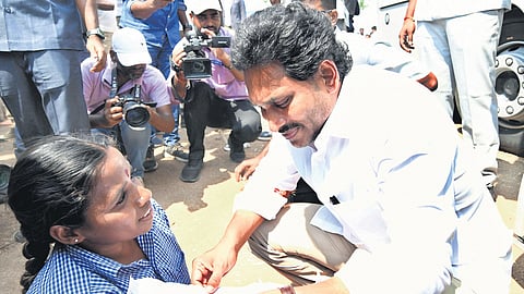 Jagan interacting with a specially-abled woman at Pathikonda on Saturday