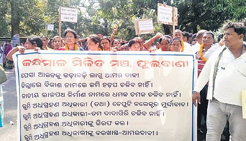 Villagers protesting the proposed bypass road in Phulbani town on Wednesday