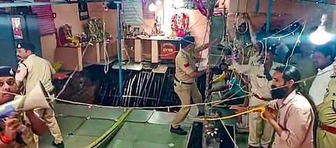 Police personnel at the site of the stepwell collapse, at Patel Nagar area, in Indore