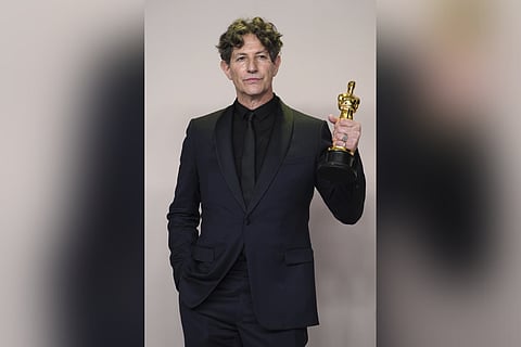 Jonathan Glazer poses with the award for "The Zone of Interest" from the United Kingdom, for best international feature film in the press room at the Oscars on Sunday, March 10, 2024, at the Dolby Theatre in Los Angeles