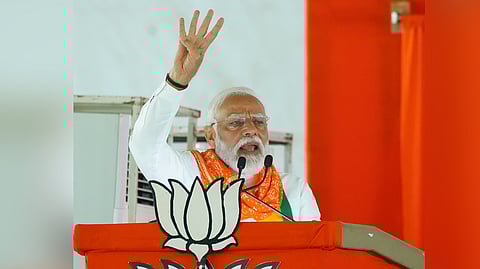 Prime Minister Narendra Modi gestures during a public meeting.
