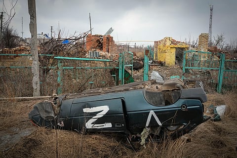 A damaged car with the symbol of the Russian troops is seen in the village of Kamenka, Kharkiv region, Ukraine, Sunday, March 17, 2024.