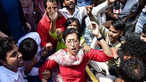 Delhi Minister Atishi with AAP workers stage a protest at ITO against the arrest of Chief Minister Arvind Kejriwal by the Enforcement Directorate