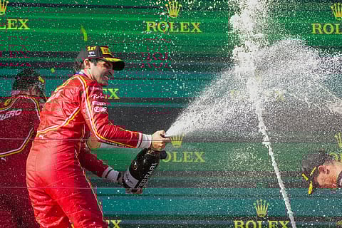 Ferrari driver Carlos Sainz of Spain sprays champagne as he celebrates after winning the Australian Formula One Grand Prix at Albert Park, in Melbourne, Australia, Sunday, March 24, 2024.