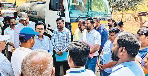 BWSSB Chairman Ramprasath Manohar talks to Bengaluru residents to take note of the water situation in the city, on Sunday.