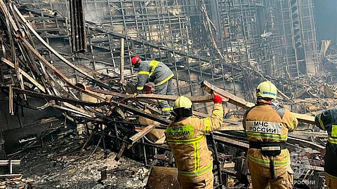 Russian Emergency Ministry rescuers work inside the Crocus City Hall on the western edge of Moscow, Russia.