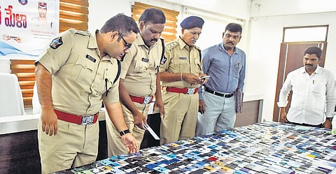 DCPs Adhiraj Singh Rana and K Srinivasa Rao at mobile recovery mela in Vijayawada on Wednesday