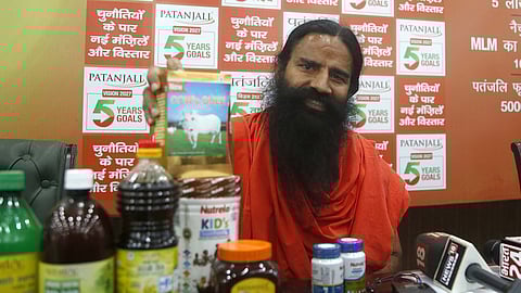 Yoga Guru and Patanjali Ayurved co-founder Ramdev speaks during a press conference in New Delhi.