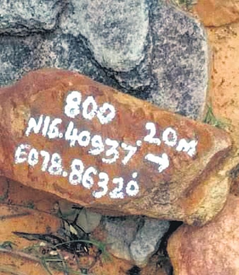 A marking on a rock claimed to be made during the recent alleged uranium survey by central and state officials in Nalgonda district