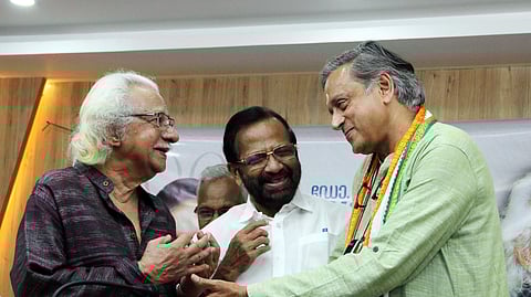 Adoor Gopalakrishnan with Shashi Tharoor after he presented a report on the strides he made during his 15-year tenure as Thiruvananthapuram MP.