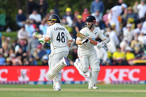 New Zealand's Kane Williamson (R) and Tom Latham run between the wickets on day two of the second Test cricket match between New Zealand and Australia at Hagley Oval in Christchurch on March 9, 2024.