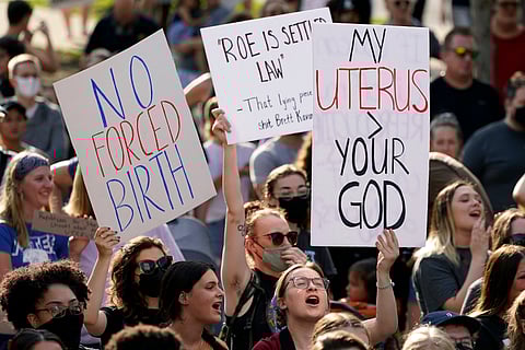 Abortion-rights protesters cheer at a rally, June 24, 2022, in Des Moines, Iowa.