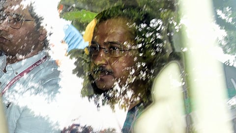 ED team leaves with Delhi CM Arvind Kejriwal to produced at Rouse Avenue Court, in New Delhi on Thursday.