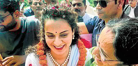 BJP candidate actor Kangana Ranaut during a roadshow ahead of Lok Sabha elections, in Mandi of Himachal Pradesh on Friday | Express