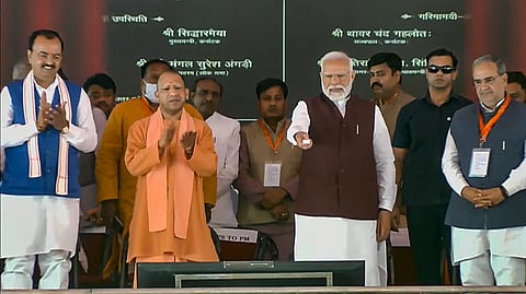 Prime Minister Narendra Modi with Uttar Pradesh Chief Minister Yogi Adityanath during the foundation stone laying and inauguration ceremony of various developmental projects, in Azamgarh, Sunday, March 10, 2024.