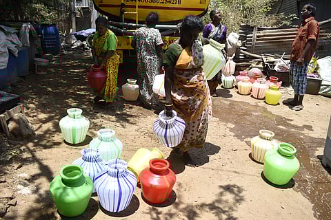 People fetching water from a private water truck at Karupakal Thottam in Coimbatore on Sunday.