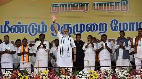 Prime Minister Narendra Modi waves at supporters during a public meeting ahead of the Lok Sabha elections, at Nandanam YMCA Ground in Chennai.