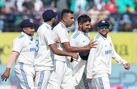 Kuldeep Yadav leads the Indian players off the field on the first day of the Dharamsala Test (Photo | PTI)