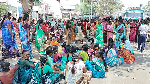 Arasadikadu residents staging a road blockade at Poolambadi village in Perambalur
on Monday