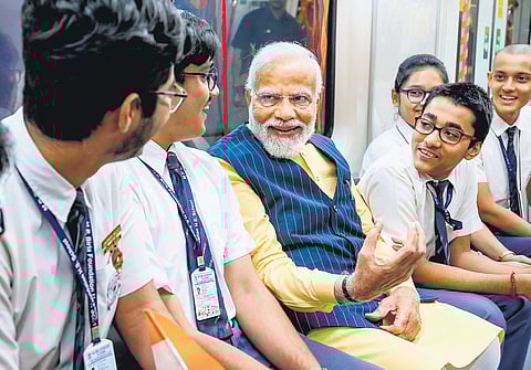 PM Narendra Modi takes a metro ride with students in Kolkata on Wednesday.