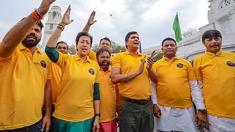 Delhi Ministers Atishi and Saurabh Bharadwaj with AAP MLAs protest at the Delhi Legislative Assembly against the arrest of Chief Minister Arvind Kejriwal, in New Delhi.