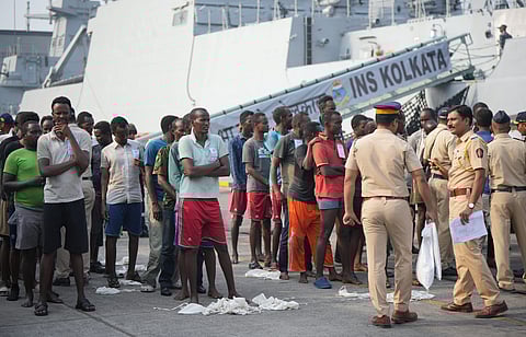 Pirates, apprehended in an operation off the coast of Somalia by the Indian Navy, being handed over to the Mumbai Police after the arrival of Warship INS Kolkata.