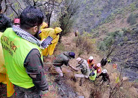 Rescue work underway after a passenger taxi rolled down a deep gorge on the Jammu-Srinagar national highway.