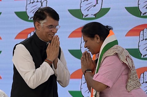 Congress leader Pawan Khera with former member of Karnataka Legislative Council Tejaswini Gowda as the latter joins Congress, in New Delhi on Saturday