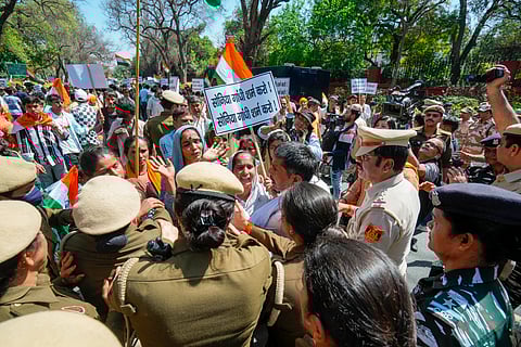 Hindu and Sikh refugees from Pakistan and Afghanistan clash with police personnel during a protest at AICC headquarters over statements made by the INDIA opposition bloc leaders on the Citizenship (Amendment) Act (CAA), in New Delhi.