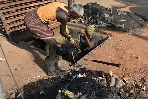 Workers engaged in manual clearing of sewers in Tamil Nadu