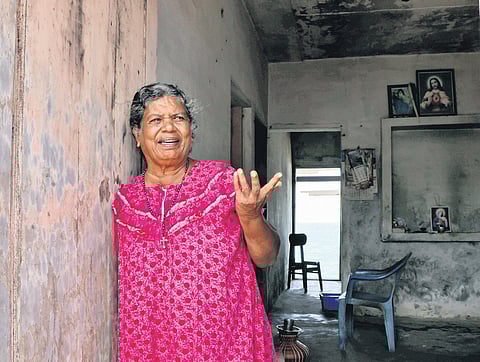 Mary Joseph at her house partially destroyed by a raging sea in Poothura
