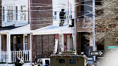 A suspect has barricaded himself in the home and was holding hostages after shooting three people to death in suburban Philadelphia.