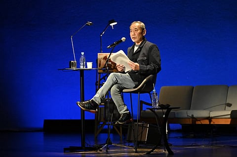 In this photo released by The Waseda International House of Literature and “Authors Alive! special edition Haruki Murakami x Mieko Kawakami,” Japanese author Haruki Murakami attends an event in Tokyo Friday, March 1, 2024.
