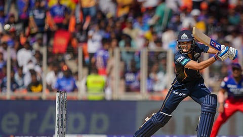 Gujarat Titans' batter Shubman Gill plays a shot during the Indian Premier League (IPL) 2024 T20 cricket match between Gujarat Titans and Royal Challengers Bangaluru, at the Narendra Modi Stadium, in Ahmedabad,