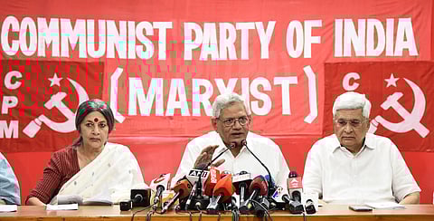 CPI(M) General Secretary Sitaram Yechury with Polit Bureau members Prakash Karat and Brinda Karat addresses a press conference organised to announce the partys manifesto for the Lok Sabha elections, in New Delhi.