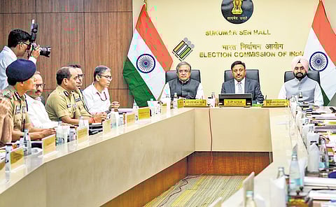 CEC Rajiv Kumar and ECs Gyanesh Kumar and SS Sandhu meet chief secretaries, DGPs and CAPF heads at Nirvachan Sadan in New Delhi on Wednesday.