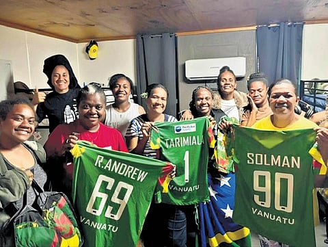 Players of the Vanuatu women's cricket team strike a pose