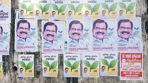 Posters of LDF’s Thomas Chazhikadan, highlighting two leaves symbol, pasted near Kalathilpady in Kottayam