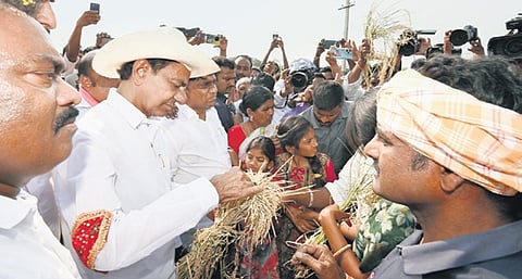 BRS president K Chandrasekhar Rao interacts with farmers
at Bowenpalli village in Rajanna-Sircilla district on Friday